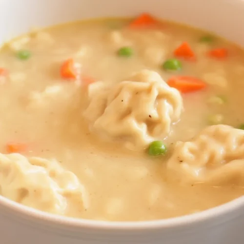 Deliciously Easy Chicken and Dumplings with Biscuits Recipe 1 Bowl of Easy Chicken and Dumplings with Biscuits, a comforting southern recipe.